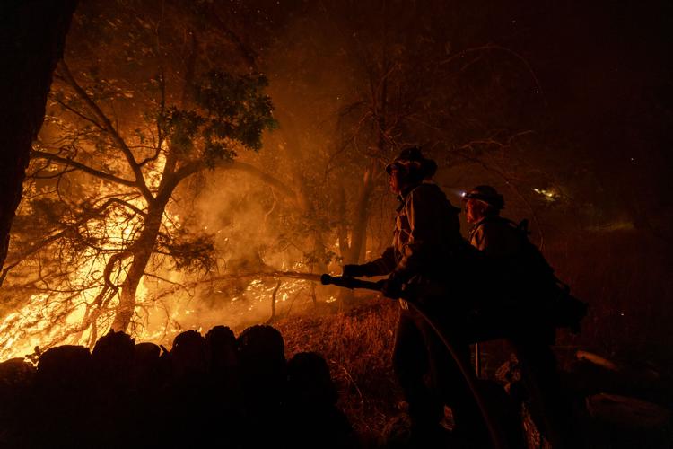 Southern California: Wildfires torch dozens of homes and force thousands to evacuate