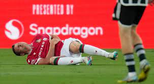 Wrexham striker injury : Paul Mullin injured with punctured lung , winning Wrexham over Man Utd